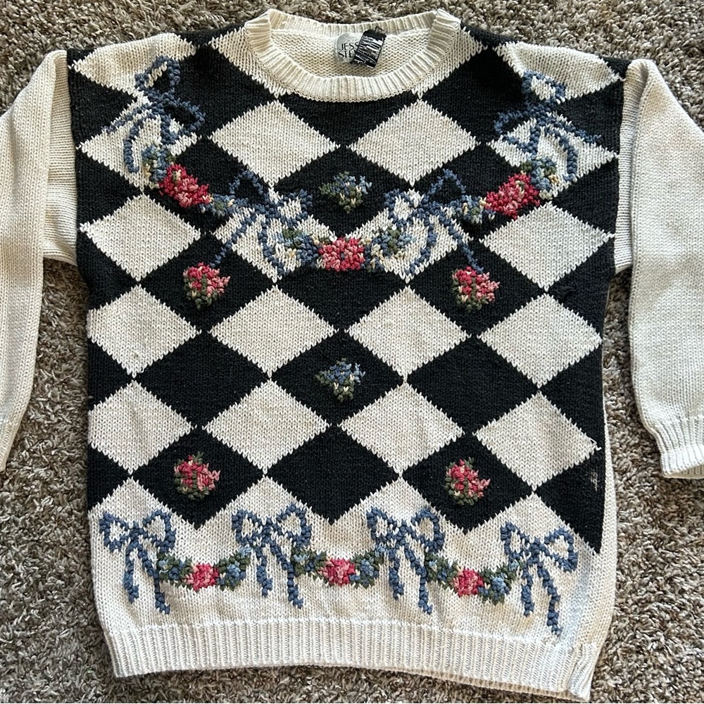 Elegant Black and Cream Diamond Sweater with Floral Details
